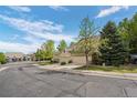 Street view of homes with well-kept lawns and easy street parking for residents and visitors at 5944 S Yank Ct, Littleton, CO 80127