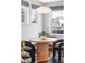 Bright dining area with a round table, bench seating, and natural light at 419 Harrison St, Denver, CO 80206