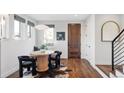 Small dining area with a round table and four black chairs at 419 Harrison St, Denver, CO 80206