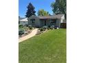 Well-maintained home with walkway, green lawn and beautiful landscaping at 488 S Leyden St, Denver, CO 80224