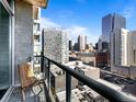 Relaxing balcony with seating and expansive views of the city skyline at 891 14Th St # 1211, Denver, CO 80202