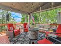 Inviting outdoor space with a cozy fire pit and comfortable seating overlooking the backyard at 10822 Eagle Crest Ct, Parker, CO 80138