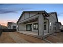 Backyard view of the home featuring a covered patio at 11452 Autumn Moon St, Littleton, CO 80125