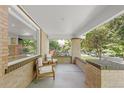 Covered front porch with comfortable seating, perfect for enjoying the outdoors at 650 Saint Paul St, Denver, CO 80206