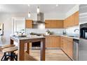 Modern kitchen featuring stainless steel appliances, granite countertops, and a breakfast bar with seating at 410 Acoma St # 309, Denver, CO 80204