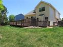 Expansive backyard with a spacious wooden deck, perfect for outdoor entertaining and relaxation at 19421 E Evans Dr, Aurora, CO 80013
