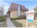 Attractive brick and siding townhome with mature landscaping, sidewalk, and 'Coming Soon' sign on a sunny day at 2323 S Jamaica St, Aurora, CO 80014