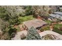 Aerial view of a well-maintained property with a large backyard and mature trees at 5503 W Colorado Ave, Lakewood, CO 80232