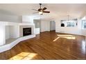 Spacious living room featuring hardwood floors and a fireplace at 445 Tumbleweed Dr, Brighton, CO 80601