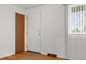 The home's light-filled entryway features a window and closet for storage at 8012 Zuni St, Denver, CO 80221