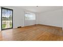 Spacious living room with hardwood floors and bright natural light at 8012 Zuni St, Denver, CO 80221