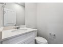 Clean, modern bathroom with white vanity, granite countertop, and chrome fixtures at 1416 Orchard St, Brighton, CO 80601