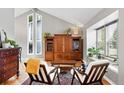 Bright living room boasts vaulted ceilings and oversized window for natural light at 6248 E Mineral Pl, Centennial, CO 80112