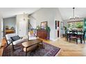 Open living room features hardwood floors and seamless flow to dining area at 6248 E Mineral Pl, Centennial, CO 80112