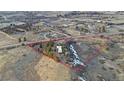 An aerial view showcases the expansive lot and the home's serene location at 428 N Perry Park Rd, Sedalia, CO 80135