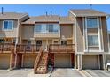 Townhouse exterior with a deck and attached garage at 17102 E Baltic Dr # F, Aurora, CO 80013