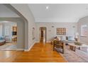 Bright living room with hardwood floors, neutral walls, and stylish contemporary furnishings at 2065 Leyden St, Denver, CO 80207