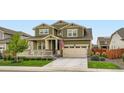 Well-maintained two story home with a manicured lawn and an attached two car garage at 16043 Fillmore St, Thornton, CO 80602