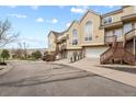 Exterior view of townhomes with private garages and a shared driveway in a quiet community at 1747 High Plains Ct, Superior, CO 80027
