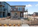 Modern two-story home with private backyard and wooden fence at 6020 N Orleans St, Aurora, CO 80019