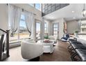Open living area with large windows and modern decor at 6020 N Orleans St, Aurora, CO 80019