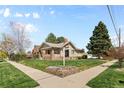 Beautiful home with lush lawn and mature trees, situated on a corner lot at 2900 Clermont St, Denver, CO 80207