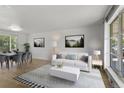 Bright living room featuring hardwood floors, neutral decor, and natural light at 4728 Dover St, Wheat Ridge, CO 80033