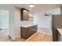 This open kitchenette features modern cabinetry, stylish countertops, and is perfect for casual dining at 1430 Lashley St, Longmont, CO 80504