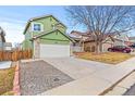 Charming two-story home with a two-car garage and long driveway at 3811 E 138Th Pl, Thornton, CO 80602