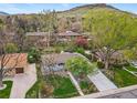 Sprawling neighborhood view with mature trees and greenery, showcasing the home's location and curb appeal at 2435 Creighton Dr, Golden, CO 80401