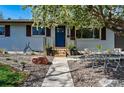 Inviting front entrance with gravel landscaping, plants, and seating area perfect for enjoying the outdoors at 2435 Creighton Dr, Golden, CO 80401