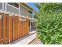 Cozy side yard enclosed by a wooden fence, offering privacy and a charming outdoor space at 2896 W 119Th Ave, Westminster, CO 80234