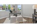 Stylish home office featuring natural light, modern furniture and neutral decor at 7778 Windwood Way, Parker, CO 80134