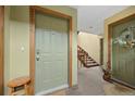 Building entry with staircase and interior doors at 23551 Genesee Village Rd # H, Golden, CO 80401