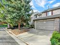 Well-maintained townhome with attached two-car garage and beautiful shade tree in front at 3529 S Telluride Cir # D, Aurora, CO 80013
