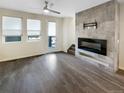 Bright living room featuring hardwood floors and a modern fireplace at 11267 Central Ct, Broomfield, CO 80021