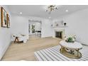 Bright living room features hardwood floors, fireplace, and neutral decor at 3930 S Hillcrest Dr, Denver, CO 80237