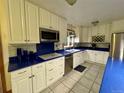 Modern kitchen with custom cabinets, stainless steel appliances, and stylish countertops at 22400 County Road 10, Hudson, CO 80642