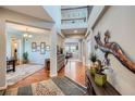 Grand foyer with hardwood floors, high ceilings, and decorative accents at 2272 Front Range Rd, Erie, CO 80516