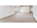 Empty dining room with carpeted floor and large window at 9748 W Peakview Dr, Littleton, CO 80123