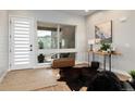 Sitting room with modern decor, large window, and a cozy seating area at 6603 Canyonpoint Rd, Castle Pines, CO 80108