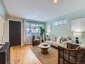 Cozy living room with hardwood floors, light walls, and modern decor at 4844 Vallejo St, Denver, CO 80221