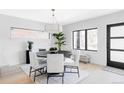 A dining room with a dark wood table, seating for five, and a light wood floor at 421 S Pearl St, Denver, CO 80209