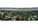 Real estate showcasing a residential neighborhood with lush trees and scenic views at 8160 W Phillips W Ave, Littleton, CO 80128