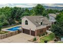Home boasts a private backyard with a sparkling in-ground swimming pool at 8160 W Phillips W Ave, Littleton, CO 80128
