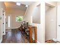 Bright entryway with hardwood floors, skylights, and stylish console table at 8160 W Phillips W Ave, Littleton, CO 80128