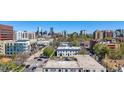 View of a city neighborhood with surrounding buildings, trees and skyline at 590 N Logan St # 303, Denver, CO 80203