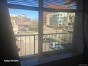 An exterior window view showcasing the surrounding neighborhood and nearby buildings at 590 N Logan St # 303, Denver, CO 80203
