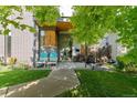 Charming home's front entrance with cozy seating, modern design, and inviting walkway at 2420 S Gilpin St, Denver, CO 80210
