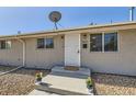 Charming single-story home with a secure front door, neat landscaping, and a stone covered yard for low-maintenance appeal at 4812 W 8Th Ave, Denver, CO 80204